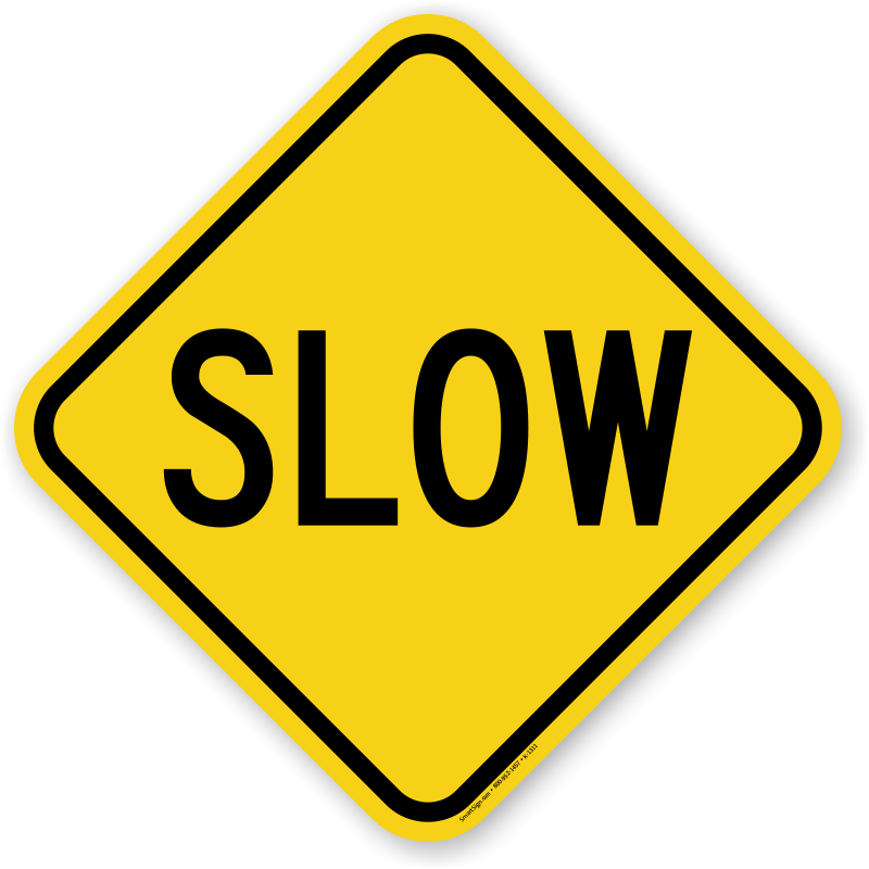 Yellow diamond-shaped traffic sign with word "slow" on it.